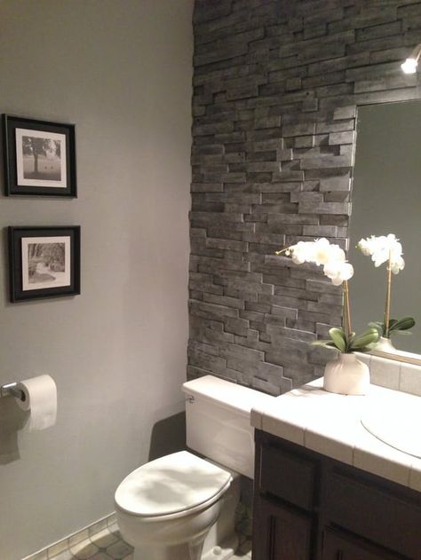 Renovation by: Wendy Location: Nevada City We wanted the look of a stacked stone accent wall in our bathroom. However, we were unable to find a stone veneer that would fit behind our toilet. We decided to use reclaimed pine which we got from used pallets. Pallet Wall Bathroom, Diy Tile Shower, Makeover Kamar Mandi, Guest Bathroom Design, Beautiful Small Bathrooms, Castle Grounds, Simple Bathroom Designs, Stone Accent Walls, Guest Bathroom Decor