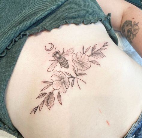 A bee, moon, and two flowers intertwined tattooed on the sternum Nature Sternum Tattoo, Sternum Tattoo, Flower Tattoo, Tattoo Ideas, Tattoos, Nature