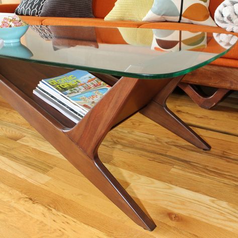 Mid-century modern wood coffee table with retro angles and glass top Cozy Mid Century Modern Living Room Coffee Tables, Mid Century Modern Coffee Table Decor, Mcm Glass Coffee Table, Mid Century Modern Living Room Coffee Tables, 60s Coffee Table, All Glass Coffee Table, Glass And Wood Coffee Table, Midcentury Modern Coffee Table, Glass Wood Coffee Table