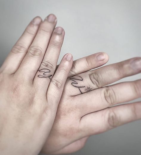 Initials Wedding Band Tattoo Mountain Ring Tattoo, Wedding Ring Tattoos For Couples, Ring Tattoos For Couples, Tree Ring Tattoo, Wedding Ring Tattoo Ideas, Ring Tattoo Ideas, Wedding Date Tattoos, Wedding Ring Tattoos, Small Letter Tattoo