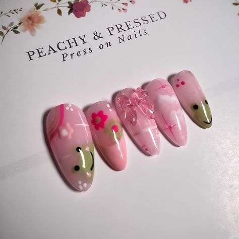 Hi, we are so happy you are here! How fun is this design? We love the adorable frog and pink details on this set - it just makes you smile! This design is shown on a medium-length almond-shaped nail, however, other shapes and sizes are available to choose from below.  With proper nail preparation and care, our nails can last up to two weeks with glue, or 2-3 days with adhesive tabs. It is highly recommended that you purchase a sizing kit if this is your first time ordering. This kit is the most Frog Nail Art, Frog Nails, Celestial Nails, Orchid Nails, Neat Nails, Ideas Uñas, Coquette Nails, Alphabet Sounds, Nail Board