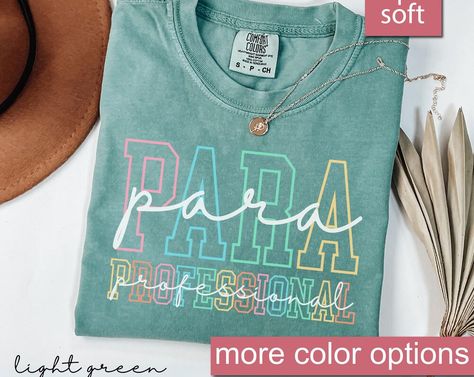 Comfort Colors® Paraprofessional Shirt, Para Squad Shirts, Funny Paraprofessional Shirt, Para Shirt Gift, Teacher Aide Shirt, Back To School. Upgrade your wardrobe with this stylish shirt. Crafted with attention to detail, it features a classic design that effortlessly combines comfort and fashion. Whether you're dressing up for a special occasion or keeping it casual, this shirt is a versatile addition to your collection. Its high-quality fabric ensures durability and a comfortable fit. Elevate Para Shirt Ideas, Teacher Squad Shirt, Paraprofessional Shirt Ideas, Paraprofessional Svg Free, Paraprofessional Shirts, Shirts For Paraprofessionals, Paraprofessional Memes, Teachers Aide, Summer Graphic Tee