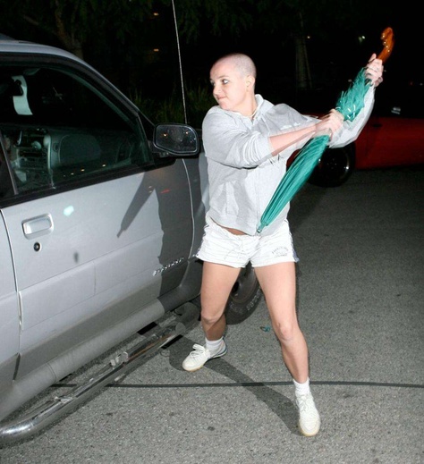 Remember when Britney Spears went crazy and took an umbrella to hit an empty car?  Well, the umbrella  went up on Ebay -- starting at $25,000. Although the auction site took the item down, bids exceeded the starting price (and may have been bought offline.) Hollywood Trashcore, Britney Spears Shaved Head, Childhood Celebrities, Immigration Art, Shave Her Head, Louis Armstrong, Shaved Head, Justin Timberlake, Angelina Jolie