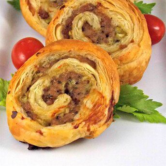 Sausage Pinwheels | Allrecipes Sausage Pinwheels, Puff Pastry Pinwheels, Pinwheels Recipe, Sausage Rolls Recipe, Homemade Pesto Sauce, Puff Pastry Appetizers, Cheese Pinwheels, Goat Cheese Tart, Pastry Appetizer