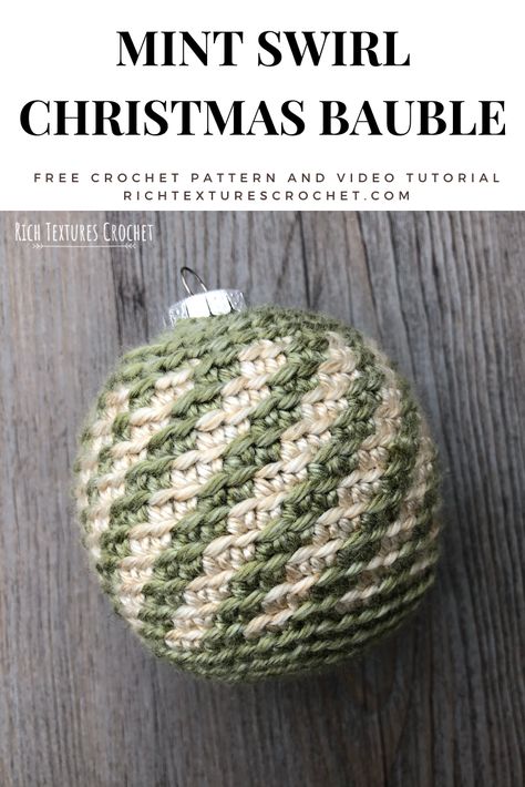 Learn how to crochet this Christmas ornament with this free crochet pattern and video tutorial.  #crochet Crocheted Christmas Baubles Free Pattern, Crocheted Balls Free Pattern, Christmas Bauble Crochet Pattern Free, Christmas Balls Crochet, Crochet Christmas Baubles Free Pattern, Crochet Christmas Balls Pattern Free, Crochet Christmas Bulbs, Glass Ball Ornament Ideas, Crochet Ball Free Pattern