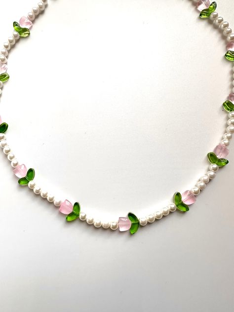 ✿ pink tulip beaded necklace with faux pearls ✿ Handmade item, includes sticker freebies! ✿ Closure: Lobster claw ✿ Adjustable length ✿ approx. 57cm long (chain included in length) ✿ Free shipping US only ✿ Shipping is UNTRACKED ✿ Feel free to contact us if you have a question about your order! Sticker Freebies, Pearl Necklace Pink, Pink Pearl Necklace, Doll Jewelry, Necklace Making, Pink Tulips, Jan 1, Faux Pearl Necklace, Long Chain