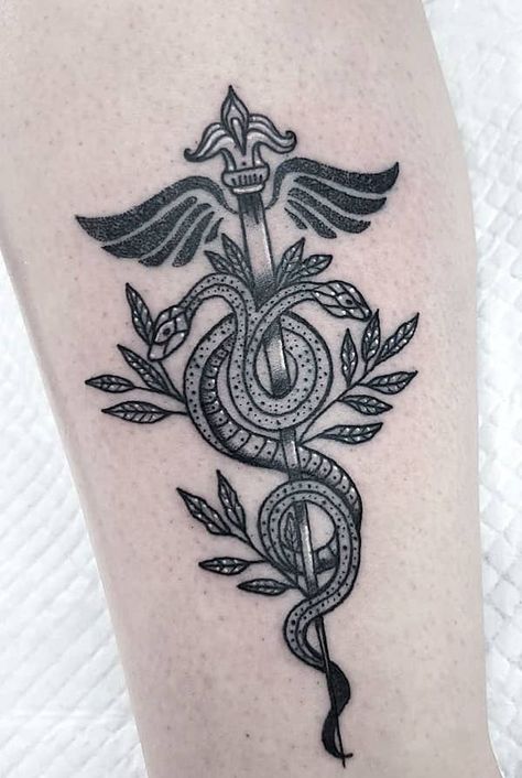 The caduceus RN symbol tattoo by @wanderingwitchtattoo Nurse Caduceus Tattoo, Nursing Symbol Tattoo, Medical Staff Tattoo, Subtle Nurse Tattoo, Nurse Practitioner Tattoo Ideas, Psych Nurse Tattoo, Nurse Tattoo Sleeve, Caduceus Tattoo Feminine, Healthcare Tattoo Ideas