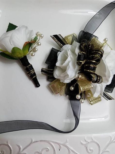 Wrist corsage has white roses, black and gold ribbon and pearly beads on golden wire. Ties onto wrist with sheer black ribbon. Comes with matching boutonniere. Artificial flowers. Ready to ship. Ships priority mail with tracking number provided. Estimated delivery day is 5 Presentation Bouquet, Cheer Sister Gifts, Corsage Ideas, Bridal Corsage, Corsage And Boutonniere Set, Plan Wedding, Boutonniere Pins, Prom Corsage, Black Gold Wedding