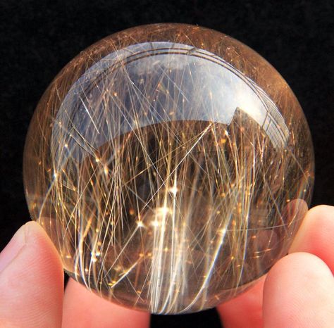 Rutilated Quartz Sphere | #Geology #GeologyPage #Mineral  Geology Page www.geologypage.com Crystal Wishlist, Auntie Life, Crystal Candy, Stone Sphere, Rutilated Quartz Crystal, Pretty Rocks, Crystal Magic, Crystal Shapes, Quartz Sphere