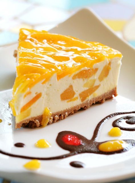 Mango Cheesecake is a beautiful, delicate dish that is perfect for parties and special occations. The Mango Cheese Cake Recipe is makde by blending the delectable fresh mangoes with crumbly cheese. The pastry for the cheese cake has a prefect crust and is a great way to enjoy the healthy and yummy yellow fruit. Serve it as a dessert for a party and this sinfully decadent pastry is sure to make your guests want for more. Peach Cheesecake, Cheesecake Factory Recipes, Fig Cake, Cheesecake Recipes Classic, Banana Cheesecake, Nutella Cheesecake, Mango Dessert, Mango Cheesecake, Peach Cake