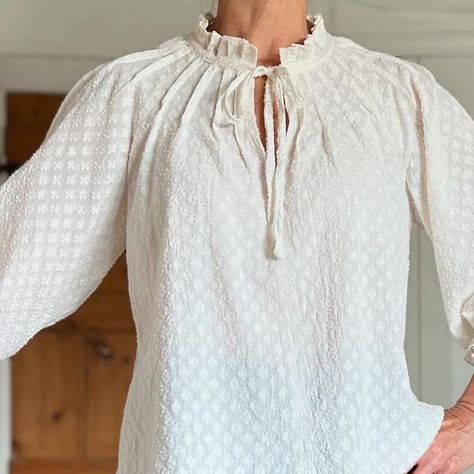 Tina on Instagram: "I’m likely to run out of space writing this so I’ll start of by saying that this is the @capsule.patterns #cpgofreblouse and is absolutely one hell of a fabulous pattern. I knew I would buy it as soon as I saw it.  It’s a raglan blouse with radiating pintucks.  The neckline can be finished with binding or extended to create a ruffled neckline.  The neckline closure can be at the front or the back with a tie or hook and eye.  View  1 is a bracelet sleeve with elastic in the cuff that holds the sleeve under the elbow for a blouson effect.  View 2 has butterfly sleeves.  You can easily extend it into a dress.  Sizing is based on bust and shoulder measurement.  There are 2 size ranges 34-46 and 44x to 56x - bust 32”/82cm to 56”/142cm - so a great size range.  I sewed a stra Space Writing, Raglan Blouse, Bracelet Sleeve, Merchant And Mills, Out Of Space, Ruffled Neckline, Bishop Sleeve, Butterfly Sleeves, Indian Cotton