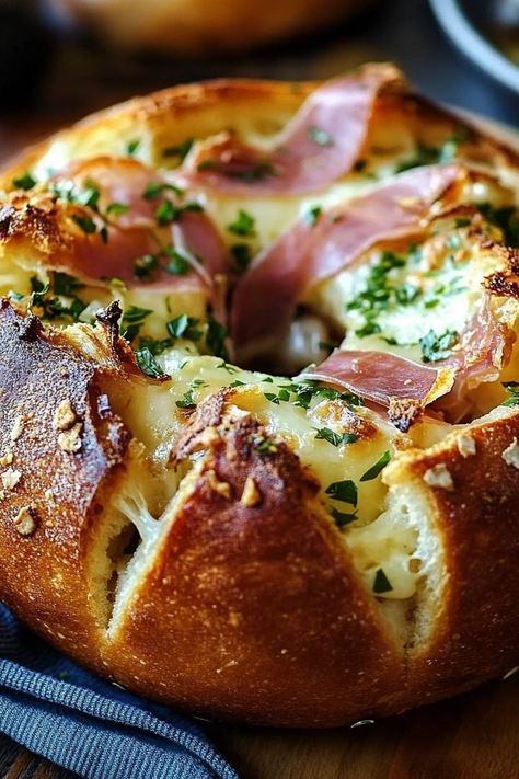 Indulge in this deliciously gooey Garlic Prosciutto & Hot Honey Baked Brie Bread Bowl! Perfect for sharing or enjoying solo! 🧀🍞

Here’s what you’ll need:

1 round Brie cheese  
1 loaf of bread (for the bowl)  
4 slices prosciutto  
2 tbsp hot honey  
2 cloves garlic, minced  
Fresh herbs (e.g., thyme or rosemary, for garnish)  

Instructions:

1. Preheat the oven to 350°F (175°C).

2. Cut the top off the bread loaf and hollow out the inside to create a bowl, saving the bread pieces for dipping!

3. In a small bowl, mix the minced garlic with hot honey.

Get ready to dig in! 😍
#bakedbrie #cheeselover #appetizer #yum #comfortfood Garlic Prosciutto And Hot Honey Baked Brie Bread Bowl, Brie Stuffed Bread, Baked Brie Bread Bowl, Baked Brie Bread, Honey Baked Brie, Brie Bread Bowl, Baked Brie Honey, Brie Bread, Honey Brie