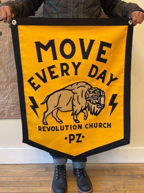 Move Every Day! Banner and pennant combo for @revolutionchurchga This banner features stitched felt lettering and bison. Each piece of the bison was stitched using our vintage chainstitch machine, adding to this banners unique one-of-a-kind look. #banner #banners #felt #moveeveryday #bestday #custombanner #custompennant #pennantbanner #collegiate #churchbanner #tradeshowbanner #eventbanner #churchdecor #churchinterior #campflag #feltbanner #tattoobanner #shopbanner #officedecor #studiodecor # Flag Design Ideas, Felt Lettering, Tattoo Banner, Tradeshow Banner, Custom Pennants, Felt Banner, Church Banners, Felt Letters, Felt Pennants