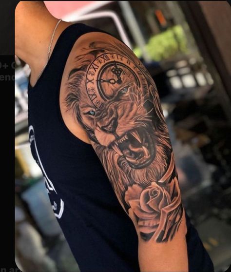 Cover Up Tattoos Half Sleeves, Lion Cross Clock Tattoo, Top Of Shoulder Tattoo Men, Lion Tattoo Half Sleeve, Black Men Shoulder Tattoo, Lion Tattoo Men, Lion Shoulder Tattoo, Animal Tattoos For Men, Leo Zodiac Tattoos