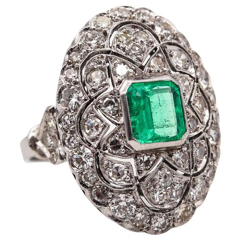 An Edwardian cocktail ring with emerald. An statement antique Belle Epoque cocktail ring, created in America during the Edwardian period, back in the 1910. This beautiful ring was carefully crafted in solid platinum with intricate geometric patterns which are embellished with a great selection of earth mined natural gemstones such: fifty-two white diamonds and one translucent Colombian emerald. The settings are finished with millegrain patterns. This ring hs exceptional details, is very delicate Jewelry History, Ring With Emerald, King Edward, Edwardian Jewelry, Colombian Emeralds, Jewelry Techniques, Shiny Things, I Love Jewelry, Beautiful Ring