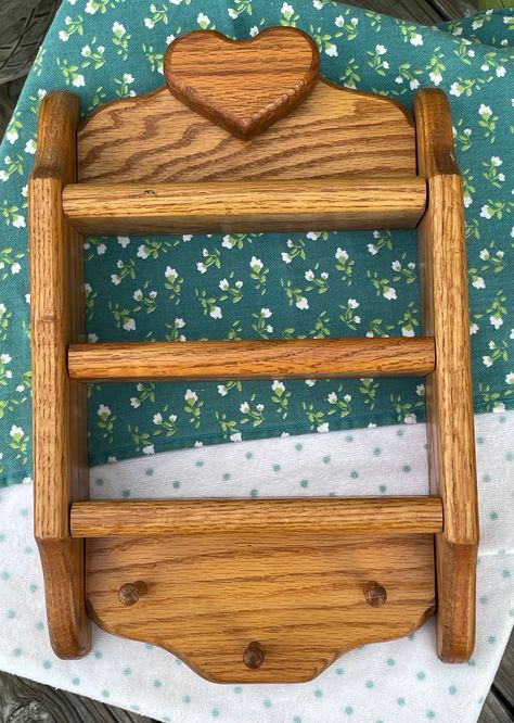 Adorable  wood shelf with heart shaped motif! This would be perfect in your kitchen as a spice rack, as part of a wall gallery to incorporate smaller trinkets, or as a display rack for your crystal collection! The little pegs also make it a great addition to a bathroom to hold necklaces and bracelets, or even your vintage hats and scarves. Thrifted Wall Decor, Heart Wood Shelf, Cottage Spice Rack, Spice Rack Vintage, Hold Necklaces, Cottage Core Spice Rack, Shelf Spice Rack, Vintage Spice Rack, Heart Shelf