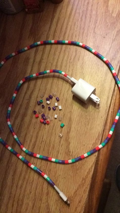 Pearler Beads on an iPhone charger Diy Wrapped Charger Cord, Perler Headphone Holder, Friendship Bracelet Phone Charger, How To Customize Your Phone Charger, Apple Watch Band Adaptor For Beading, Diy Chargers, Charger Cord, Iphone Charger, Hacks Diy