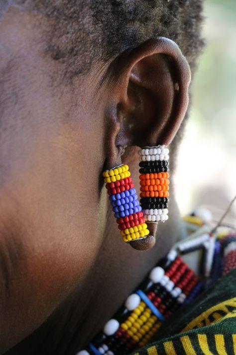 Traditional African earring on a Maasai woman in Kenya. Masai Jewelry, African Wall Art, Sunglasses Strap, Indie Style, Fair Trade Jewelry, African Earrings, Handmade Fair, Maasai, Indie Fashion