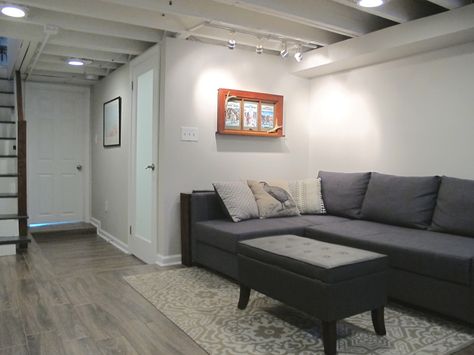 Finished small and shallow basement - Tiled floors, exposed beams painted white, and BM pale oak paint. Small Basement Design, Basement Ceiling Options, Small Basement Remodel, Pale Oak, Basement Layout, Tiled Floors, Kallax Regal, Bedroom Minimalist, Wood Tile Floors