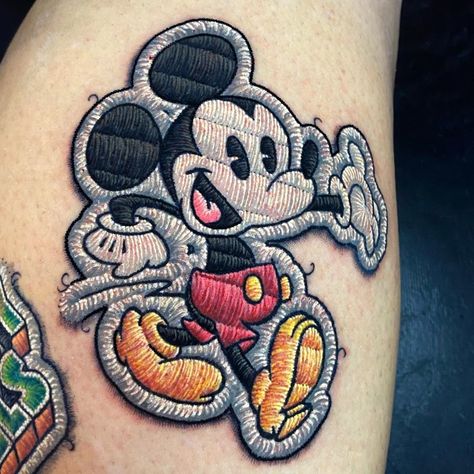 Patch Tattoos, Mickey Tattoo, Mickey Mouse Tattoo, Patchwork Tattoo Ideas, Stitch Tattoo, Embroidery Tattoo, Mouse Tattoos, Patchwork Tattoo, Geniale Tattoos