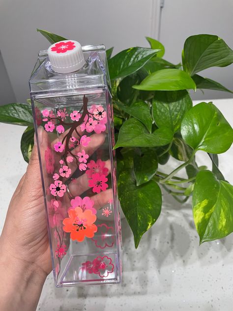 Holpgraphic pink and hot pink cherry blossoms on all side of clear milk carton water bottle Bedazzled Bottle, Pregnancy Reveal Gifts, Pink Water Bottle, Cute Water Bottles, Flower Cup, Milk Carton, Starbucks Tumbler, Diy Cups, Custom Cups