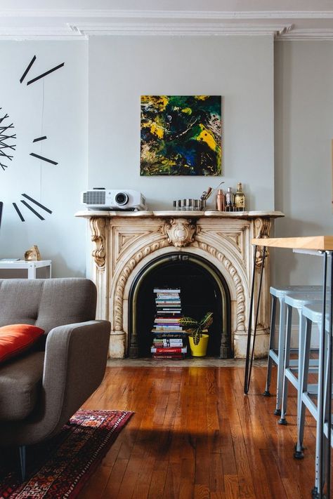 Modern art of the vintage fireplace Brooklyn Brownstone, Furniture Placement, Furniture Layout, City Living, Fireplace Decor, Apartment Room, Home Entertainment, Wall Spaces, Apartment Therapy