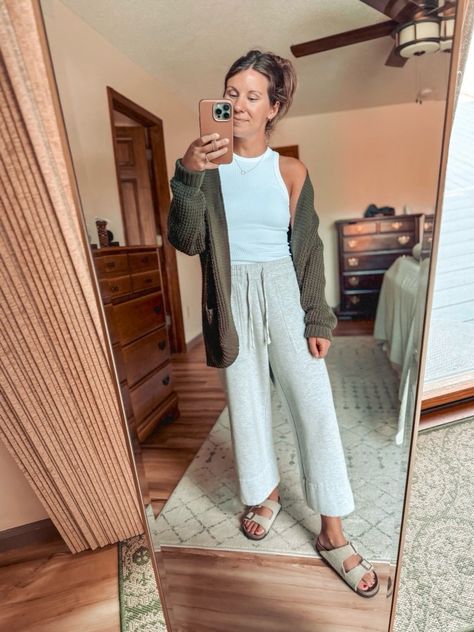 grey wide-leg sweatpants outfit, white tank top style, green cardigan fashion, gold jewelry accessories, taupe suede Birkenstock sandals, casual loungewear look, relaxed weekend wear, comfy yet chic, effortless athleisure style, cozy fall outfit, neutral tone fashion, elevated casual wear, stylish loungewear, versatile cardigan outfit, laid-back casual chic, minimalist fashion inspiration, comfy and stylish, casual layering ideas, relaxed yet stylish, transitional season outfit ideas. Cute Casual Weekend Outfits, Comfy Outfits For Home Lazy Days, Rehab Outfit, Work From Home Loungewear, Grey Wide Leg Sweatpants Outfit, Elevated Loungewear Outfits, Casual Chic Minimalist, Wide Leg Sweatpants Outfit, Grey Sweatpants Outfit