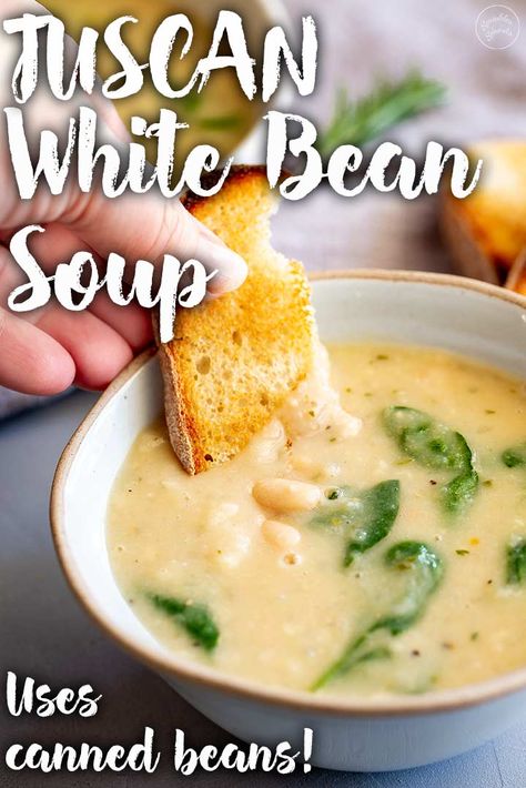 This Easy Creamy Tuscan White Bean Soup is pure comfort food. Warming, delicious, healthy soup that tastes rich and creamy despite the lack of heavy cream. Rosemary, garlic, and parmesan give this the authentic Tuscan flavor, while the canned beans mean it is a sinch to make, ready in under 20 minutes this is the perfect bowl of soup for winter nights when you need a quick and easy meal for the whole family. Northern Beans Soup Recipe, Recipes For Great Northern Beans, Recipes Using Canned Great Northern Beans, Great Northern Beans Soup, Canned Northern Bean Recipes, Recipes With Great Northern Beans, Canned Great Northern Beans Recipe, Northern White Beans Recipes, Tuscan Beans Recipe