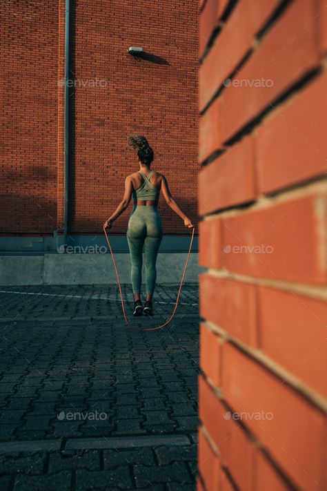 Jumping towards a healthier lifestyle by bernardbodo. Young woman skipping rope on the city streets #Sponsored #bernardbodo, #Young, #lifestyle, #Jumping Jump Roping Aesthetic, Jump Rope Aesthetic, Jump Rope Photography, Skipping Rope Aesthetic, Heavy Jump Rope, Rope Skipping, Jumping Rope, Vision 2024, Skipping Rope