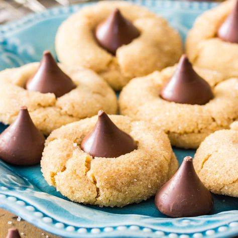 Peanut Butter Blossoms Peanut Butter Blossoms Recipe, Sugar Cookie Icing Recipe, Sugar Spun Run, Peanut Butter Blossom, Butter Blossoms, Soft Peanut Butter Cookies, Cookie Icing Recipe, Peanut Butter Blossom Cookies, Blossom Cookies