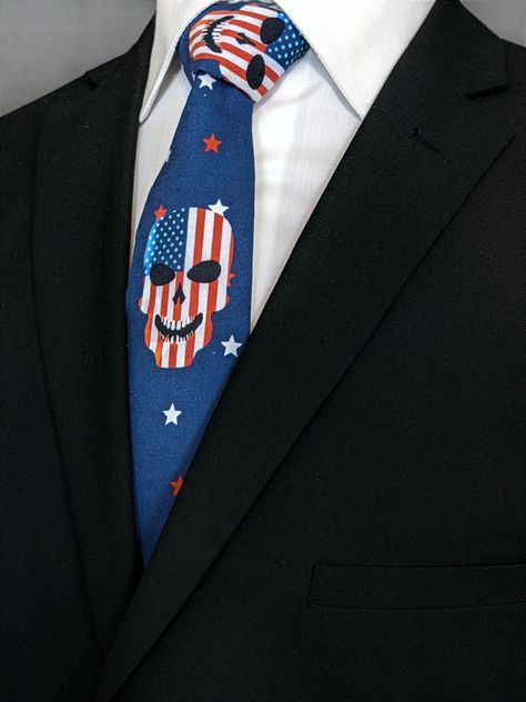 The 4th of July Skull Necktie features a blue background with American flag skull and star pattern. #4thOfJuly #4thOfJulyNecktie #Necktie #Skull #SkullNecktie Skull Tie, White Goth, Make A Tie, Purple Suits, Broken Arrow, Blue Ties, Star Pattern, Tall Guys, Star Patterns