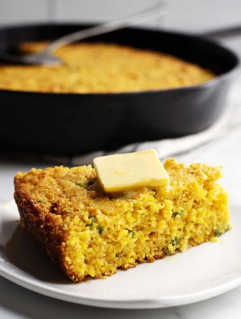 An easy and delicious recipe for Mexican Cornbread! Made in a cast iron skillet for all those crispy edges and loaded with sharp cheddar cheese, jalapenos, and green onions! #mexicancornbreadrecipe #easymexicancornbread #loadedmexicancornbread Mexican Cornbread In Cast Iron Skillet, Authentic Mexican Cornbread, Easy Mexican Cornbread, Green Chile Cornbread, Mexican Cornbread Recipe, Salsa Ranchera, Cornbread Recipes, Cheddar Cornbread, Mexican Cornbread