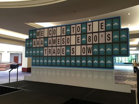 This game show board was an awesome outside-the-box addition to AAA's 80's themed trade show! Board Game Prom, Board Game Center Piece, Board Game Backdrop, Game Show Themed Party Ideas, The Game Of Life Decorations, Game Show Party Ideas Decorations, Game Show Party Decorations, Game Show Theme Party, Gameshow Set Design