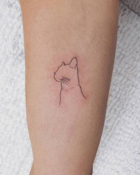 Cat Elbow Tattoo, Tattoos Of Cats For Women, Cat Tattoo Back Of Arm, Tattpp Ideas Woman Arm, Cat Ears Tattoo Simple, Silhouette Cat Tattoo, Cat Side Profile Tattoo, Cat Memorial Tattoo Minimalist, Cat Profile Tattoo