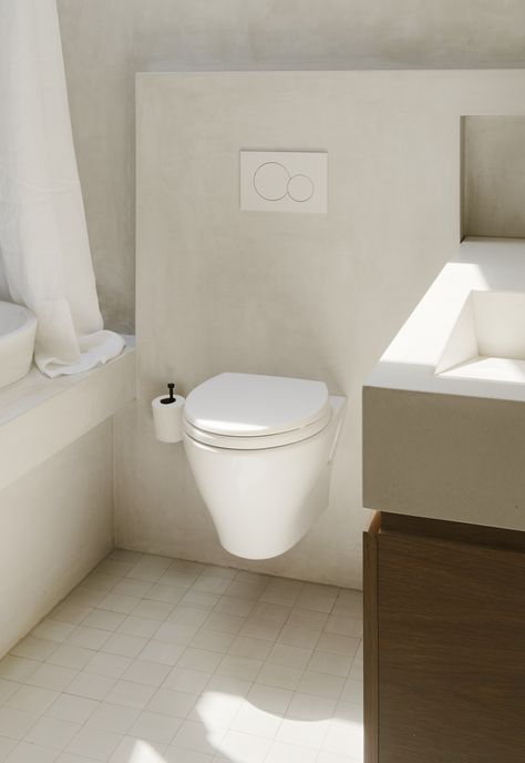 white wall mounted toilet in ivory plaster finish bathroom Corner Shower Stalls, Finish Bathroom, Plaster Finish, Bathroom Remodel Cost, New Bathroom Ideas, Mounted Toilet, Finished Bathrooms, Bathtub Design, Brooklyn Heights