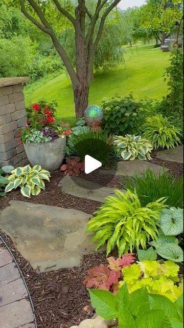 Joy in the Garden 🌸Joyce Merschman Ludlow on Instagram: "Early summer in this part shade zone 5b Iowa garden brings different hues, shape, and textures. This garden has evolved quite a bit over just the last two years. My biggest learning… let plants overlap! It creates flow and connectivity in the garden.  People who have primarily shade gardens, often want more sun. People who have primarily sun gardens, often want more shade. I was a sun gardener that loved it until more shade was created as my tree matured. And now I’ve discovered so many beautiful shade-loving plants and I long for more shade.  Although the container in this reel is in part shade, there’s a matching container with the same plants in full sun. So the plants in this container can take sun and shade. I’ll keep you updat Iowa Garden, Sun People, Landscaping With Large Rocks Natural, Landscaping With Boulders, Garden Flower Beds, Landscaping Inspiration, Landscaping With Large Rocks, Shade Flowers, Rock Garden Landscaping