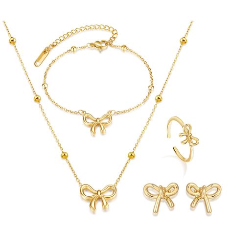 PRICES MAY VARY. GOLD JEWELERY SET:The ring, earrings and necklace are designed in the image of a bow, very cute and fashionable, adding beauty and elegance to you. BOW RING :The adjustable ring has an open design, you can change the size to fit your finger, very comfortable to wear. BOWKNOT EARRING:The gold jewellery set is made of high quality material, not easy to fade, long lasting, safe and non-allergenic, can be worn alone or stacked with other rings for a stylish layered look. GIFT:Butter Metal Jewelry Sets With Clavicle Chain For Weddings, Wedding Jewelry Set With Clavicle Chain, Wedding Jewelry Set With Metal Necklace, Gold Plated Clavicle Chain Jewelry Sets For Parties, Gold Alloy Jewelry, Gold-plated Metal Jewelry, Metal Jewelry Sets With Plating For Gifts, Elegant Alloy Jewelry Sets For Gifts, Gold-tone Brass Jewelry For Anniversary