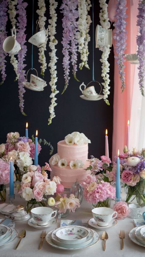 Outdoor fairy garden birthday party setup with a moss-covered table, soft pink cushions, whimsical balloon arch, string lights, and delicate floral decorations, creating a magical and enchanting atmosphere. Flowers For Tea Party, Teacup Birthday Party Ideas, Alice In Wonderland Pastel Colors, Tea Party Birthday Snacks, Pastel Alice In Wonderland Party, Baby’s First Birthday Theme Girl, Alice Birthday Party, Tea Party Nursery, Tea Party For Two 2nd Birthday