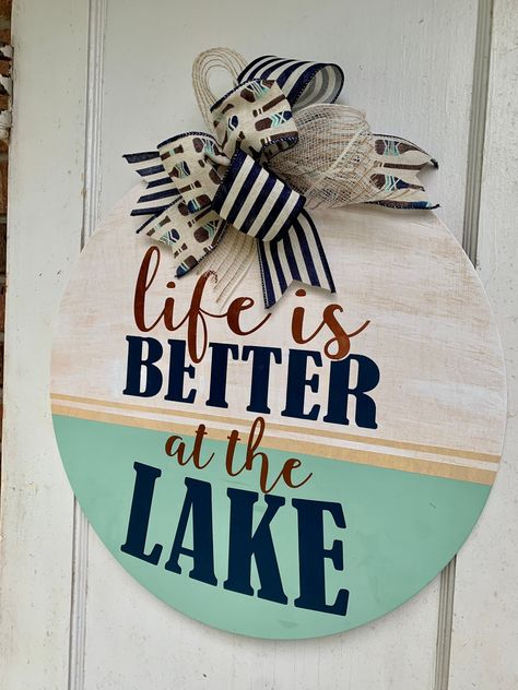 Life is just better at the lake, isn't it? Bring this door hanger with you the next time you visit the lake house. We suggest that all of our signs be showcased in a shaded spot, away from the outside elements. Persistent exposure to sun, rain, and extreme temperatures will impact the quality of the product.  SHIPPING INFORMATION -  Processing time is currently 3-5 business days. All items shipped with USPS priority mail, 1-3 days. Please see estimated ship date before purchasing. Please communi Round Front Door Sign, Lake Life Decor, Round Front Door, Circle Signs, Craft Signs, Lake Vibes, Lake Gifts, Wooden Snowmen, Round Signs