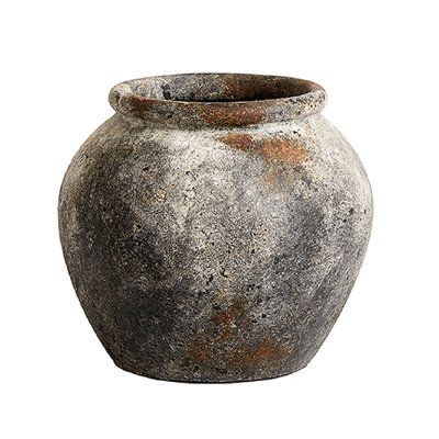 This terracotta table vase adds a vintage touch to a traditional shape. Made from terracotta with a distressed gray finish, this vase has a rustic style with a wide urn shape and a rounded lip. It's suitable for both indoor and outdoor use, which means it's just right for adding a rustic-chic detail to your living room end table or for housing flowers in the garden. With a 12'' width, it's about the size of a large basketball, a great size for making a visual impact without taking up too much sp Funky Vases, Color Terracota, Dry Plants, Water Hyacinth, Living Room End Tables, Beautiful Bouquet Of Flowers, Table Vases, Terracotta Pots, Nixon