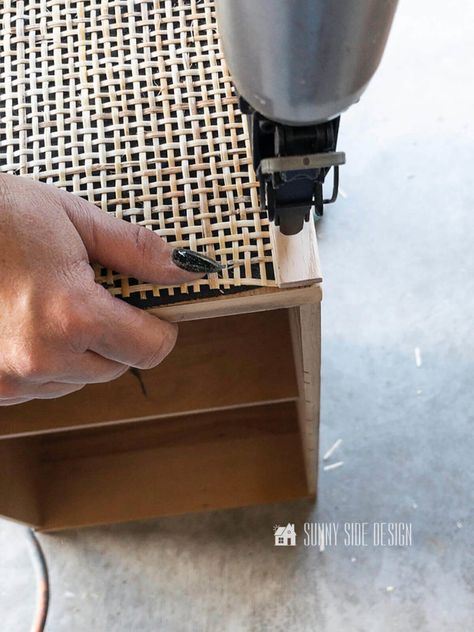 Woman attaching oak trim to rattan covered drawer front with a brad nailer. Diy Night Stand, Shabby Chic Patio, White Rattan, Rattan Chairs, Diy Furniture Redo, Diy Nightstand, Painted Drawers, Diy Drawers, Desk Makeover