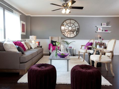 A rich shade of gray gets a pop of color from magenta and plum purple accents in this contemporary living room. Black And Red Living Room, Plum Color Palette, Purple Living Room, Deco Zen, Accent Colors For Gray, Purple Bedroom, Glam Living Room, Living Room Red, Trendy Bedroom