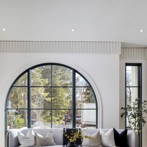 Stan Makow on Instagram: "French transitional house designed by @makowarchitects on 50’ lot arched window in living room frames a unique view @saaze_building_group #torontocustomhomes #luxuryhomes #dreamhomes #customhomes #frenchtransitional #moderndesign #interiordesign" Arch French Window, Transitional House Design, Living Room Frames, French Transitional, Room Frames, French Arch, Arch Window, Transitional House, Arched Windows