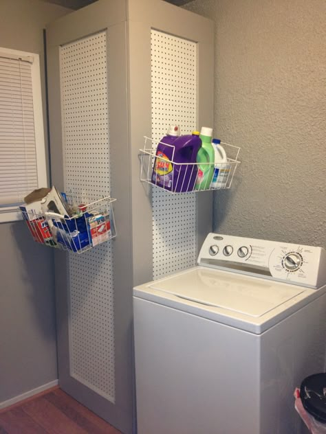 Water heater hidden by usable storage space a giant peg board! This is in my laundry room courtesy of my father in law! I love! Hide Water Heater, Water Heater Cover, Toto Toilet, Remodel Basement, Basement Laundry Room, Basement Laundry, Modern Basement, Garage Laundry, Hot Water Tank