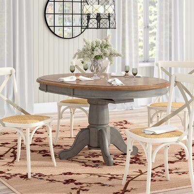 Anchor your dining space in the country cottage style with this charming dining table. Crafted of solid rubberwood in a distressed brown stain for a timeworn touch, the tabletop strikes an oval-shaped silhouette with thick apron sides. A 15" W leaf elongates the design to 57" L x 42" W to comfortably accommodate six guests. Rounding out the design, the thick pedestal base features a carved column center with four curvy cabriole legs. | Laurel Foundry Modern Farmhouse® Jaydin Pedestal Extendable Restain Furniture, Refinishing Table, Table Refinishing, Harvest Tables, Table Redo, Dining Table Makeover, Kitchen Table Makeover, Dining Table Wood, Kitchen Tables