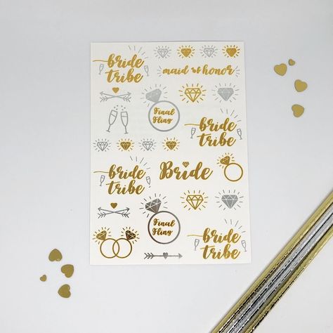 We know you want your bachelorette party to be free of needless stress and worry, and you want tattoos that will LAST and SHINE.  Bridal Temporary Tattoos are perfect for your wedding, bachelorette party, hen party, engagement party, girls' night out etc.  The super on trend Gold foil and Silver is sure to be loved by everyone. They're fun, flashy, feminine, and flirty! PACKAGE INCLUDES 2x sheets of temporary tattoos for a total of 56 tattoos. Each sheet measures 21cm (H) x 15cm (W).  Safe, non- Cheeky Tattoos, Bridal Tattoo, Party Tattoos, Brides With Tattoos, Wedding Bachelorette Party, Hen Do, Bride Tribe, Tattoo Stickers, Hen Party