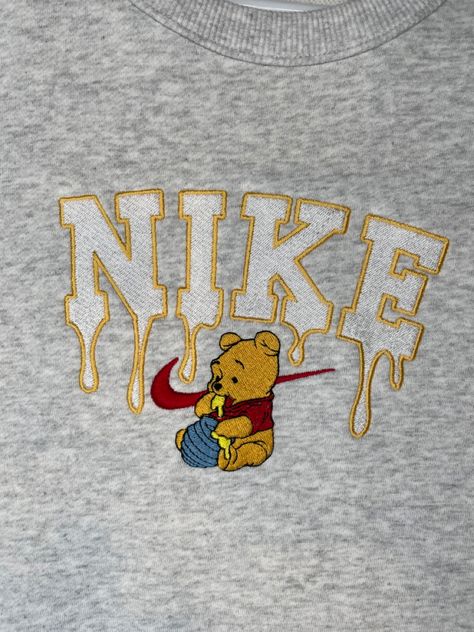 Grey 
Yellow 
Honey 
Winnie the Pooh 
Sweatshirt 
Hoodie 
Jumper 
Crewneck 
Nike 
Embroidery 
Embroidered Custom Nike Sweatshirts, Nike Sweatshirts Diy, Cute Nike Sweatshirts Custom, Diy Nike Sweatshirt, Embroidery Crewneck Ideas, Nike Embroidered Sweatshirt, Custom Nike Sweatshirt, Jumper Embroidery, Embroided Sweatshirt