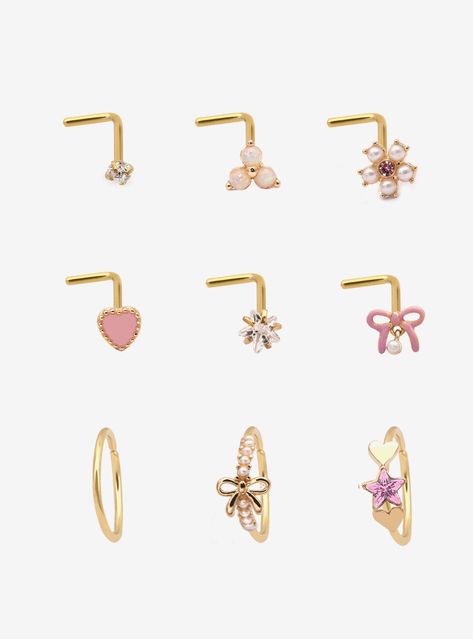 Gold-tone set including 6 nose studs and 3 nose hoops with pink heart  bow  star and flower designs. Plus  opalescent  faux pearl and pink gem detailing.Jewelry care: Wash with antibacterial soap and warm water.Piercing care: Wash hands thoroughly  then clean piercing with H2Ocean (sold separately) or saline solution.316L surgical steel Nickel-free2mm - 7.5mm designsSet of 9Use in healed piercings only. Remove immediately if irritation occurs. Do not use harsh or alcohol-based che Hot Pink Nose Ring Hoop, Bow Nose Piercing, Cute Nose Piercing Jewelry, Cute Piercings Nose, Pink Piercings, Nose Ring Aesthetic, Cute Nose Studs, Heart Nose Stud, Gold Nose Piercing