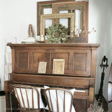 Farmhouse - Antique Piano at home on SweetCreek Piano As Tv Stand, How To Decorate A Piano Top, Antique Upright Piano, Antique Piano Decor, Piano Decor Ideas, Top Of Piano Decor, Piano Decorating Ideas, Upright Piano Decor, Piano Styling