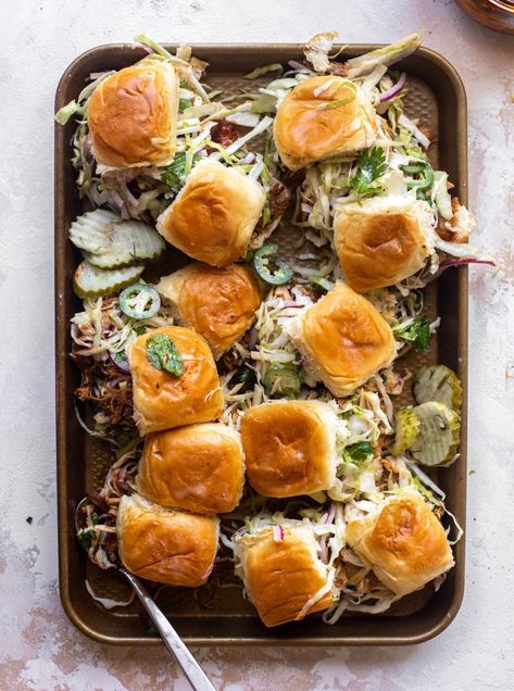 We love these root beer pulled pork sliders! The pulled pork is cooked in the slow cooker until tender and juicy, then tossed with my root beer BBQ sauce. Serve on slider rolls piled high with a crunchy jalapeño apple slaw. So good! Jalapeno Slaw, Root Beer Bbq Sauce, Root Beer Pulled Pork, Beer Bbq Sauce, Rootbeer Pulled Pork, Beer Pulled Pork, Homemade Rootbeer, Weekend Recipe, Slider Rolls